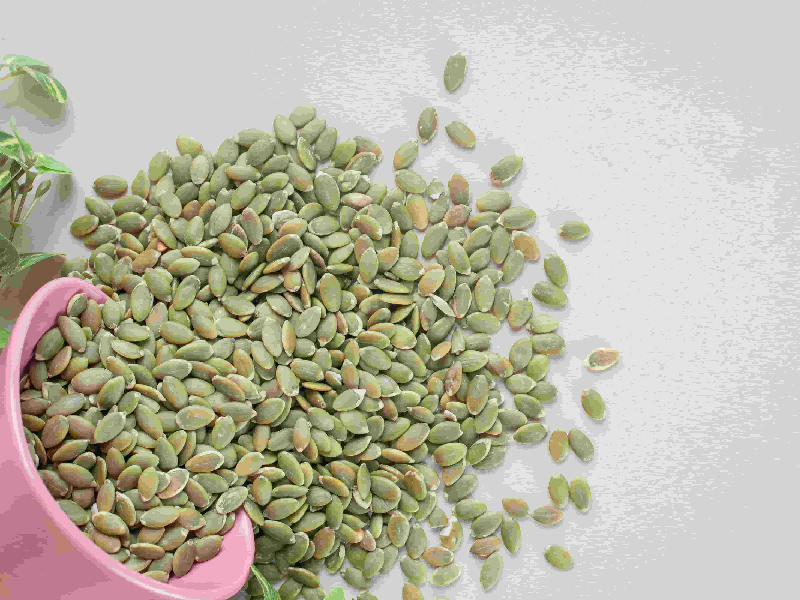 A close-up of flax seeds in a small bowl, showing their flat, brown, and slightly shiny texture